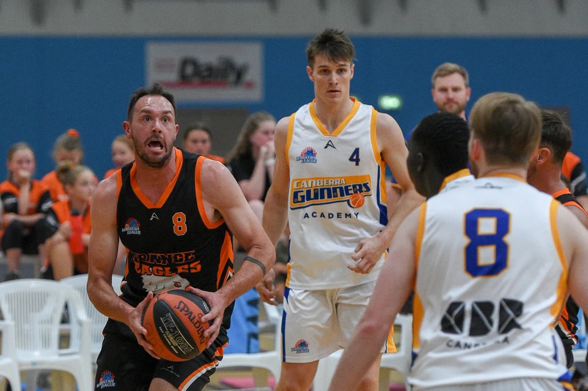 A player driving to the basket in club teamwear