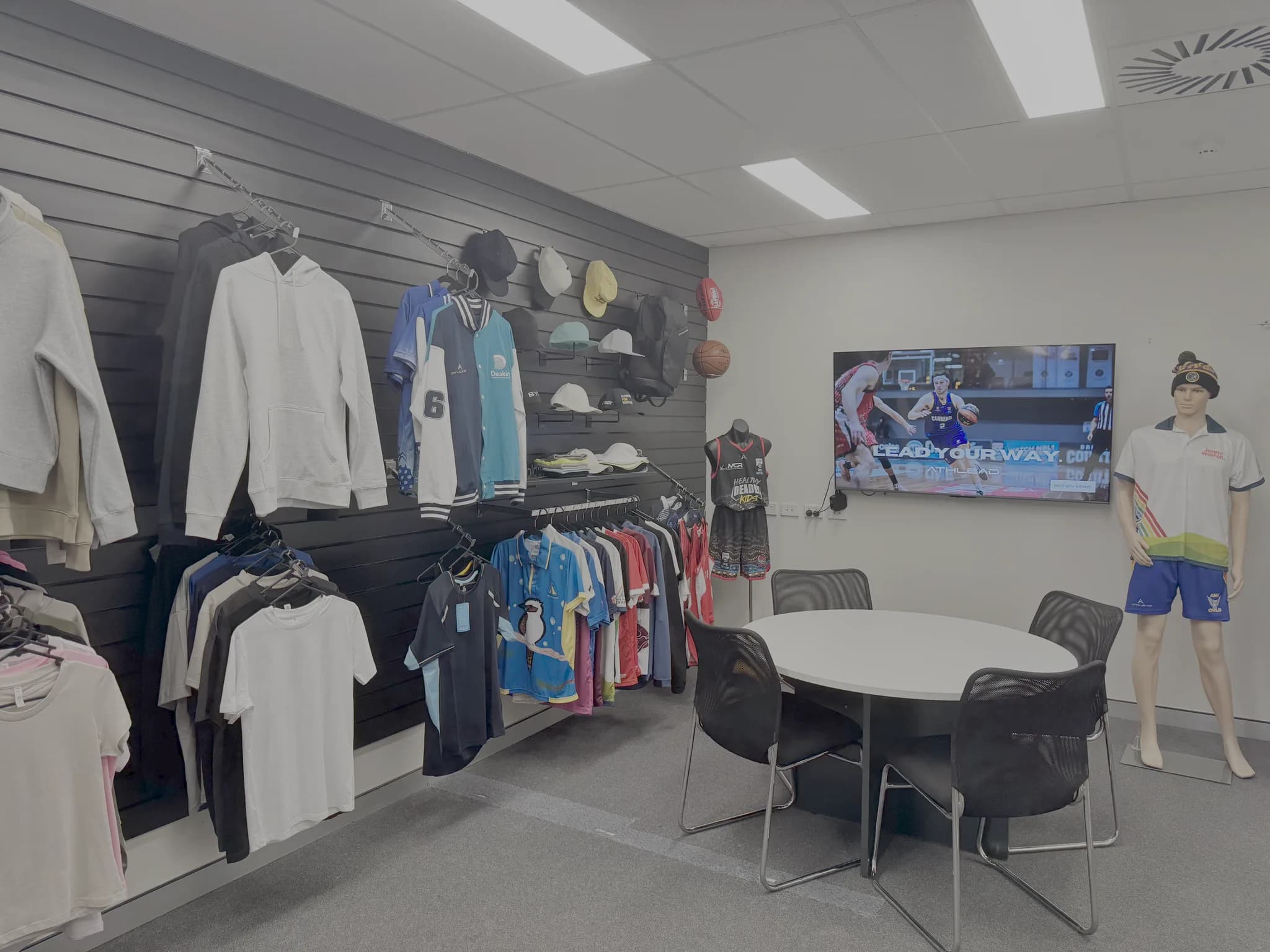 The Athlead showroom - apparel racks, samples and a space to plan kit